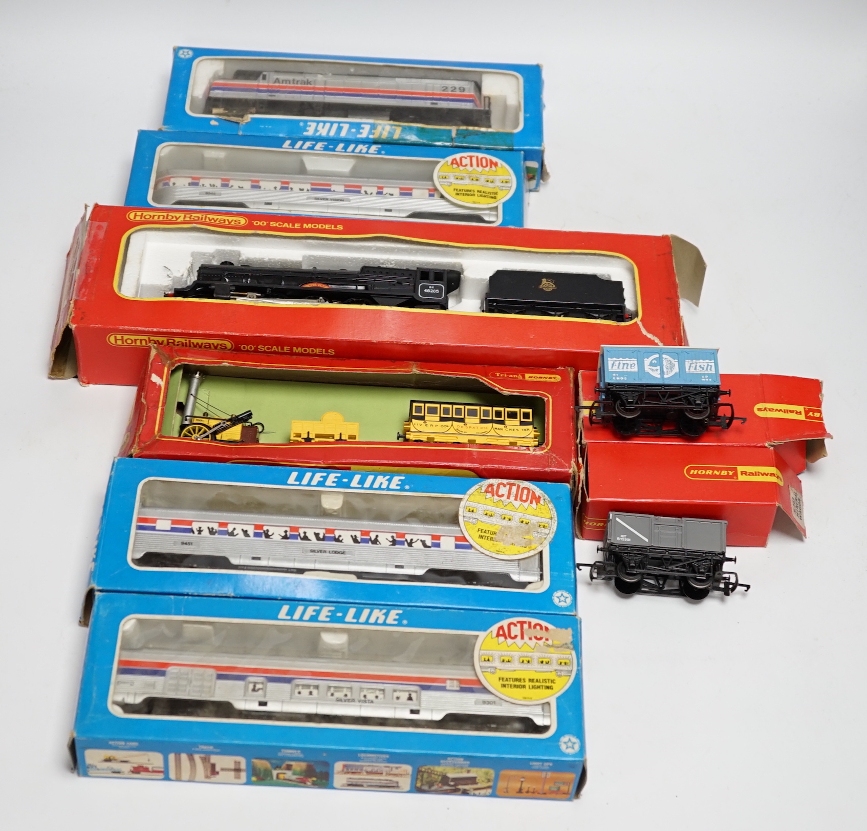 Eight items of 00 and HO gauge model, railway, including; a Tri-ang Stevenson’s Rocket set (R346), a Hornby Railways Princess Class locomotive (R050), An Amtrak diesel locomotive, and three coaches, etc.